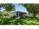 A screened lanai provides an outdoor retreat off the back of the home at 15038 Tamarind Loop, Spring Hill, FL 34609