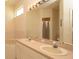 Bright bathroom with a double sink vanity and a soaking tub at 15038 Tamarind Loop, Spring Hill, FL 34609