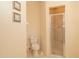 Bathroom featuring a toilet and stand up shower with glass door at 15038 Tamarind Loop, Spring Hill, FL 34609