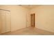 Neutral bedroom with carpet, closet, and adjacent entry to another room at 15038 Tamarind Loop, Spring Hill, FL 34609