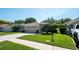 Charming single-story home with well-manicured lawn and attached two-car garage at 15038 Tamarind Loop, Spring Hill, FL 34609