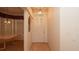 Bright and welcoming hallway featuring neutral tones and a transom window above the front door at 15038 Tamarind Loop, Spring Hill, FL 34609