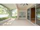 Screened-in lanai providing a panoramic view of the lake at 15038 Tamarind Loop, Spring Hill, FL 34609