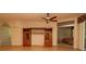 Elegant living area showcasing built-in storage and an open doorway to the main bedroom at 15038 Tamarind Loop, Spring Hill, FL 34609