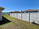 A long vinyl privacy fence encloses the spacious backyard at 15585 Rene Ct, Brooksville, FL 34604