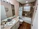 Bathroom features a vanity sink with granite countertop, and a tub shower with tile backsplash at 15585 Rene Ct, Brooksville, FL 34604