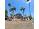 Deerfield community sign surrounded by mature palm trees and landscaping under a clear blue sky at 15585 Rene Ct, Brooksville, FL 34604