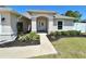 Charming single-story home with a landscaped front yard and inviting entryway at 15585 Rene Ct, Brooksville, FL 34604