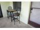 Outdoor balcony seating with a metal table and two chairs, perfect for enjoying the fresh air and views at 1881 Mazo Mnr # I-6, Lutz, FL 33558
