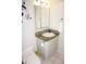 Bathroom with a single sink vanity, mirror, toilet, and tile flooring at 1881 Mazo Mnr # I-6, Lutz, FL 33558