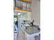 Cozy kitchen with white cabinets, and a lofted area above at 1881 Mazo Mnr # I-6, Lutz, FL 33558