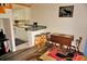 Partial view of the kitchen with breakfast bar and adjacent dining area with seating at 1881 Mazo Mnr # I-6, Lutz, FL 33558