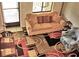 Cozy living room featuring a comfortable sofa, accent chair, and unique patterned rug at 1881 Mazo Mnr # I-6, Lutz, FL 33558