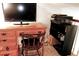 Office desk and chair with a monitor and printer, and a decorative bookcase at 1881 Mazo Mnr # I-6, Lutz, FL 33558