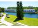 Scenic water view with golf cart and picnic table creating a serene and inviting outdoor space at 1881 Mazo Mnr # I-6, Lutz, FL 33558