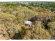 Aerial view of wooded lot with small cottage at 1916 & 1910 Beachway Ln, Odessa, FL 33556