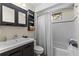 Bathroom with a shower-tub combo and vanity at 1916 & 1910 Beachway Ln, Odessa, FL 33556