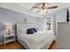 Comfortable bedroom with white bedding and natural light at 1916 & 1910 Beachway Ln, Odessa, FL 33556
