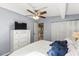 Bedroom with a ceiling fan and view of dining area at 1916 & 1910 Beachway Ln, Odessa, FL 33556