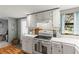 Bright kitchen features white cabinets, countertops, and appliances at 1916 & 1910 Beachway Ln, Odessa, FL 33556