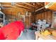 Interior shot of the shed with wood framing, storage racks, and ample space for tools and equipment at 1916 & 1910 Beachway Ln, Odessa, FL 33556