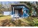 This shed features painted exterior and covered entryway at 1916 & 1910 Beachway Ln, Odessa, FL 33556