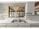 Stainless steel sink with a window view at 1916 & 1910 Beachway Ln, Odessa, FL 33556