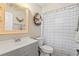 Bathroom featuring vanity, decorative mirror, and shower with curtain at 2400 Commack Ct, New Port Richey, FL 34655