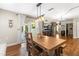 Dining area features wood table and seating with backyard view at 2400 Commack Ct, New Port Richey, FL 34655