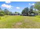 Wide shot of the property showcasing the extensive land and various buildings on site at 2400 Commack Ct, New Port Richey, FL 34655