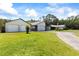 A charming single-story home with multiple garage spaces and an expansive front yard at 2400 Commack Ct, New Port Richey, FL 34655