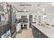 Guest house kitchen boasts stainless steel appliances, marble countertops, and ample cabinet space at 2400 Commack Ct, New Port Richey, FL 34655