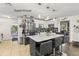 Modern kitchen with center island, great floors and stainless steel appliances in the guest house at 2400 Commack Ct, New Port Richey, FL 34655