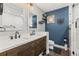 Modern bathroom featuring double sinks, wood cabinets, and neutral paint at 2400 Commack Ct, New Port Richey, FL 34655