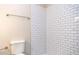 Bathroom featuring a toilet and tiled shower at 2729 Penzance St, Palm Harbor, FL 34684