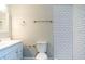 Bathroom with a vanity, toilet, and tiled shower at 2729 Penzance St, Palm Harbor, FL 34684