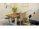 Dining area featuring a wood table and chairs with decorative sunflowers at 2729 Penzance St, Palm Harbor, FL 34684