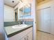 Bathroom boasts a single vanity with white cabinetry, and a tiled floor at 3054 Oakbrook Cir, Clearwater, FL 33759