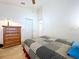 Inviting bedroom featuring a ceiling fan, natural light, and ample closet space for storage and relaxation at 3054 Oakbrook Cir, Clearwater, FL 33759