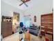 Cozy bedroom featuring wood furnishings, ceiling fan, and neutral walls at 3054 Oakbrook Cir, Clearwater, FL 33759