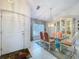 Formal dining area with glass table, decorative china cabinet, and lots of natural light at 3054 Oakbrook Cir, Clearwater, FL 33759