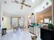 Kitchen with vaulted ceiling, stainless steel appliances, breakfast nook, and tiled flooring at 3054 Oakbrook Cir, Clearwater, FL 33759
