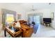 Bright and airy living room featuring vaulted ceilings, tile flooring, and a comfortable sofa at 3054 Oakbrook Cir, Clearwater, FL 33759