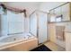 Relaxing main bathroom showcasing a soaking tub, separate shower, and vanity space for a luxurious experience at 3054 Oakbrook Cir, Clearwater, FL 33759