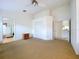 Spacious main bedroom with large closets, ensuite bath, and neutral carpet providing a relaxing retreat at 3054 Oakbrook Cir, Clearwater, FL 33759