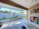Relaxing sunroom with tile floors and screens offering serene views of the backyard and ample natural light at 3054 Oakbrook Cir, Clearwater, FL 33759