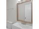 A bathroom featuring a white sink vanity and a mirror at 3141 Loomis Dr, New Port Richey, FL 34655