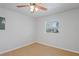 Bedroom with wood-look floors, and a window for natural light at 3141 Loomis Dr, New Port Richey, FL 34655