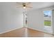 Bedroom with natural light, ceiling fan, and wood-look floors at 3141 Loomis Dr, New Port Richey, FL 34655