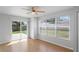Bedroom with large windows and sliding glass door offering plenty of natural light and access to outside at 3141 Loomis Dr, New Port Richey, FL 34655